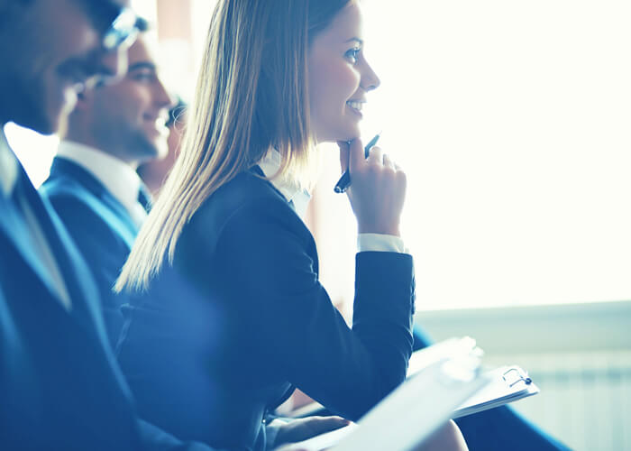 A businesswoman attentively listening